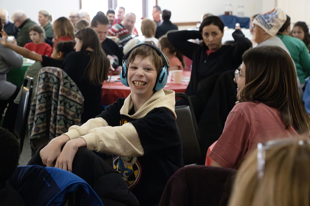Student smiling when he sees santa