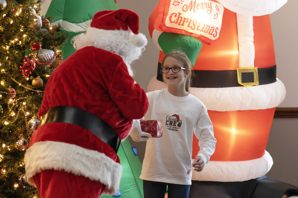 Student getting his gift from Santa