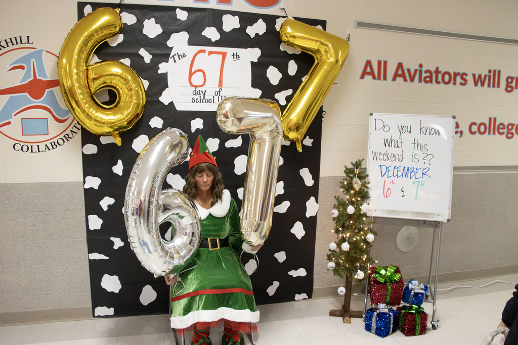 Sugarplum holding 6-7 balloons