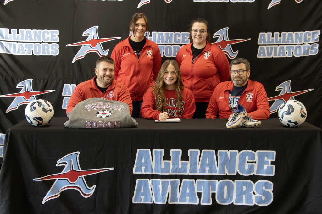 Ava with her coaches