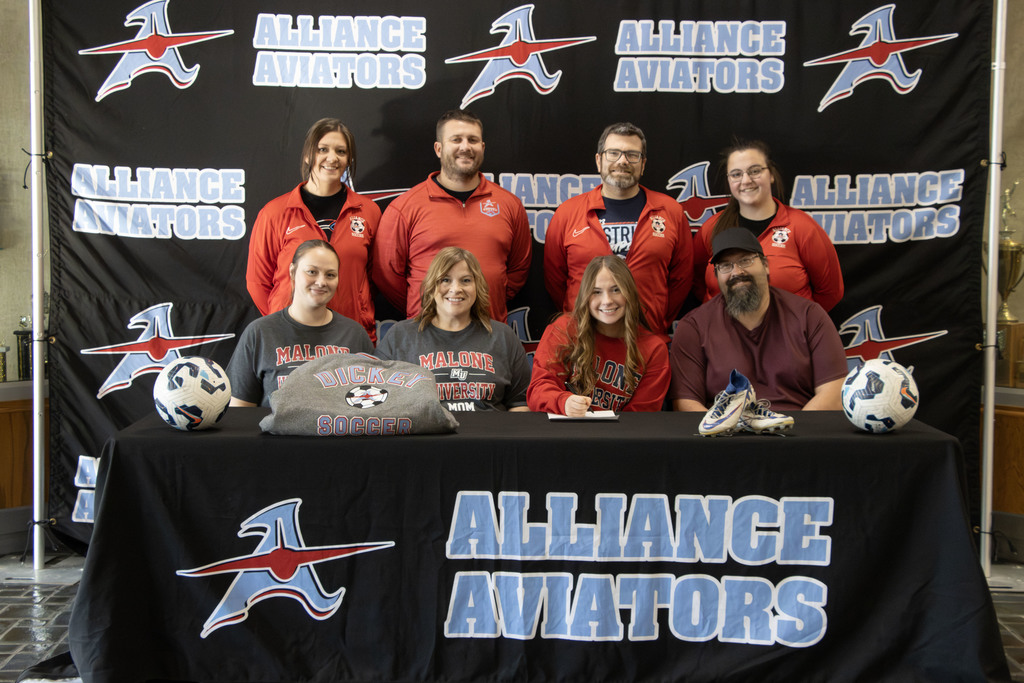 Ava with her family and coaches