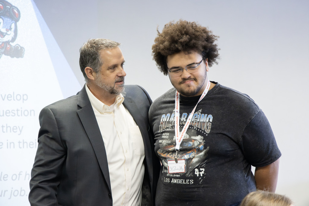 Rob Gress talking to a student