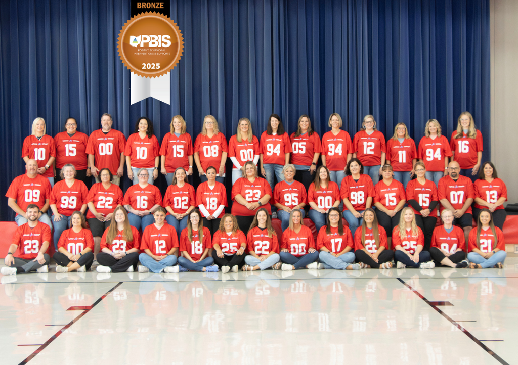 group picture of all AES staff with the PBIS Bronze badge over laid on it.