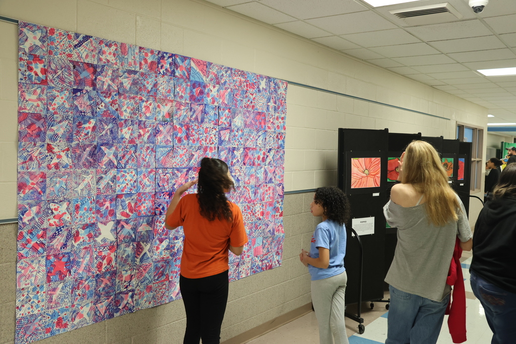 students looking at artwork