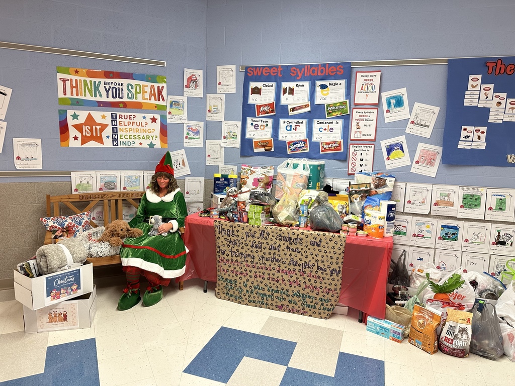 Sugarplum McJingles with the items donated for the Humane Society