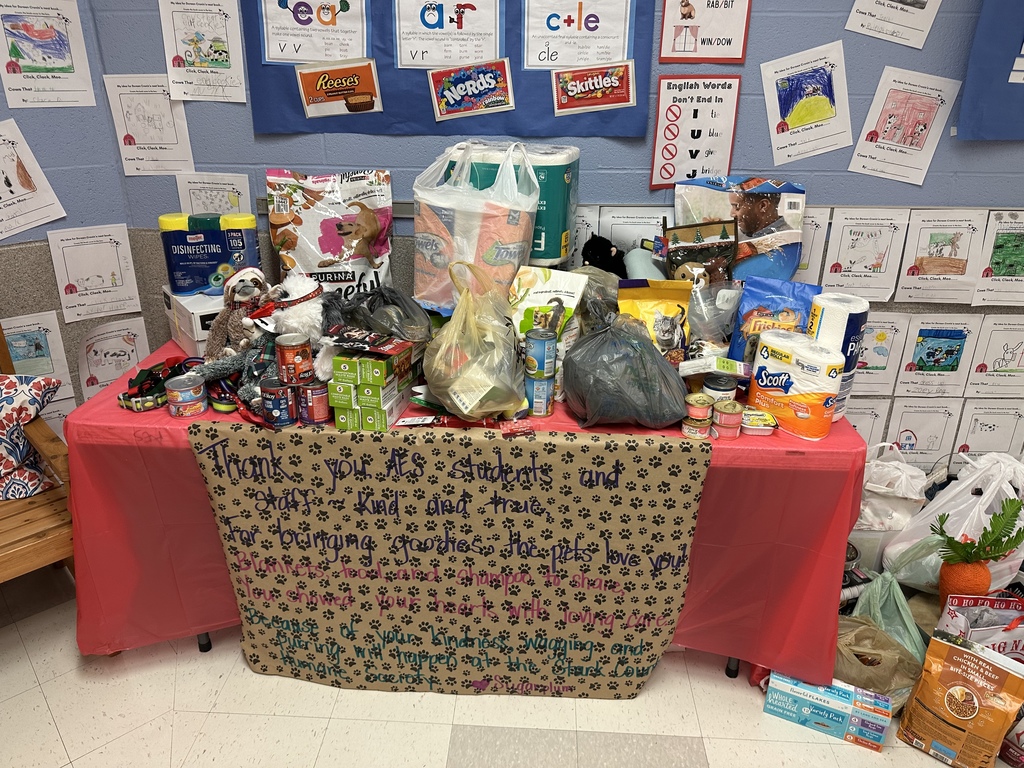 A table full of donated items for the humane society