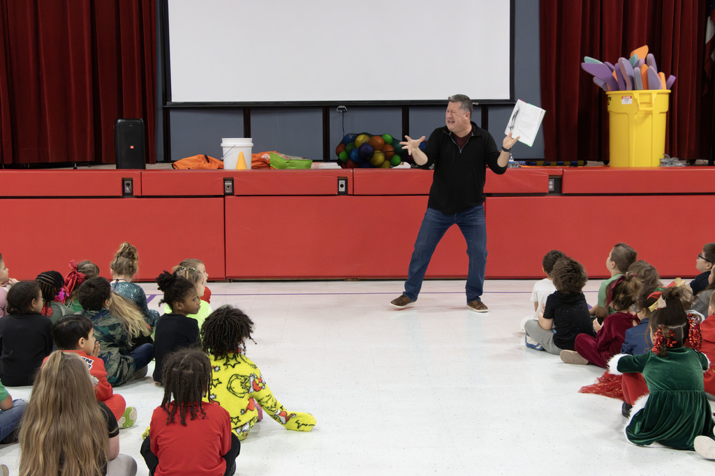 Kevin Kern reading animatedly to the students