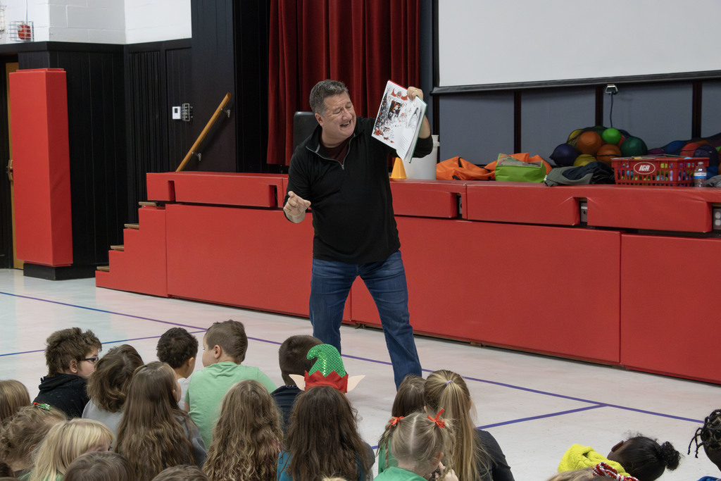 Kevin Kern reading animatedly to the students
