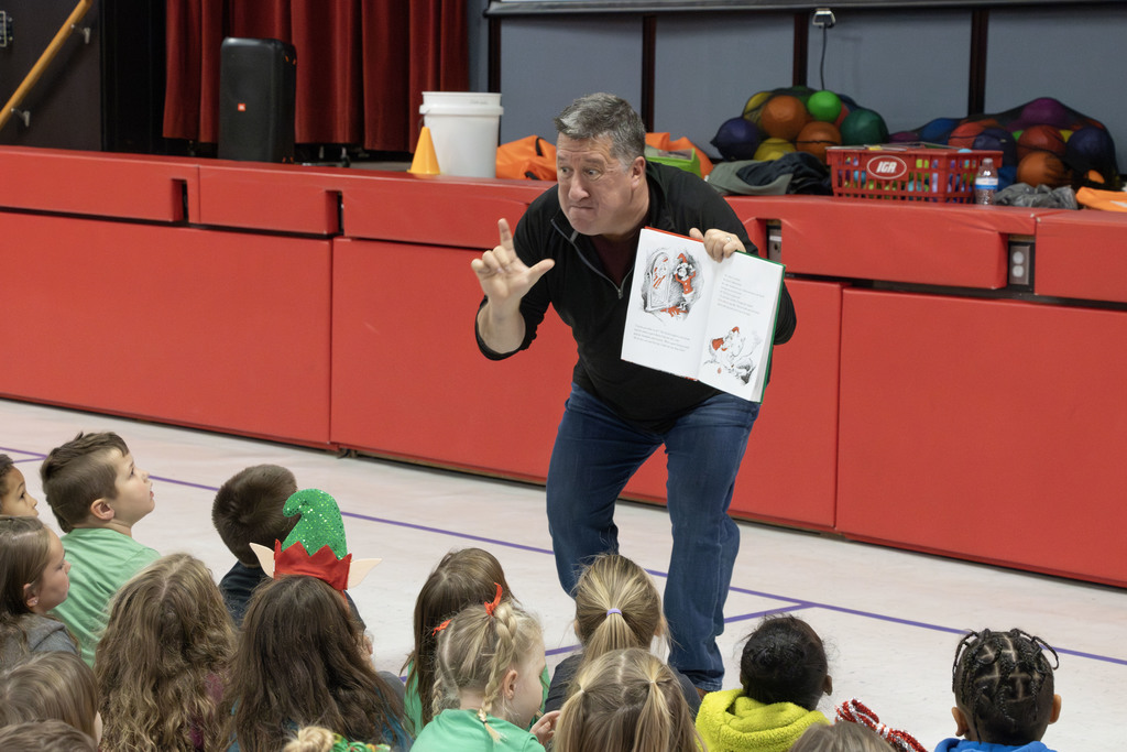 Kevin Kern reading animatedly to the students