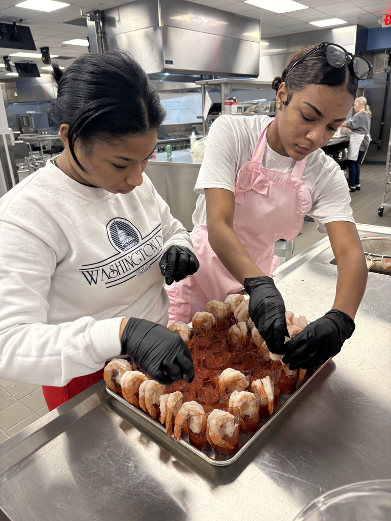 two students preparing shrimp cocktails