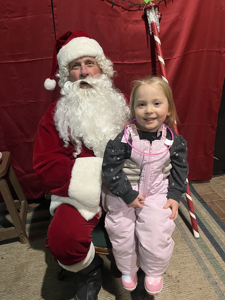 Ensley sitting with Santa Claus