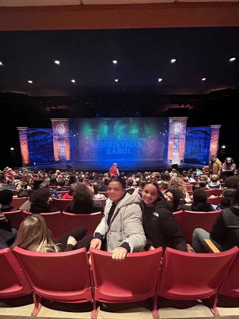 students waiting for the play to begin