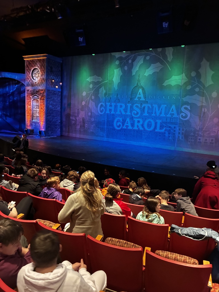 Students waiting for the play to begin
