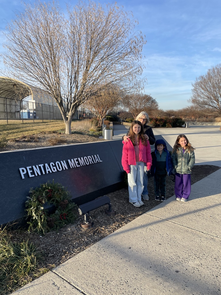 Lily & Joe standing in front of the Pentagon Memorial