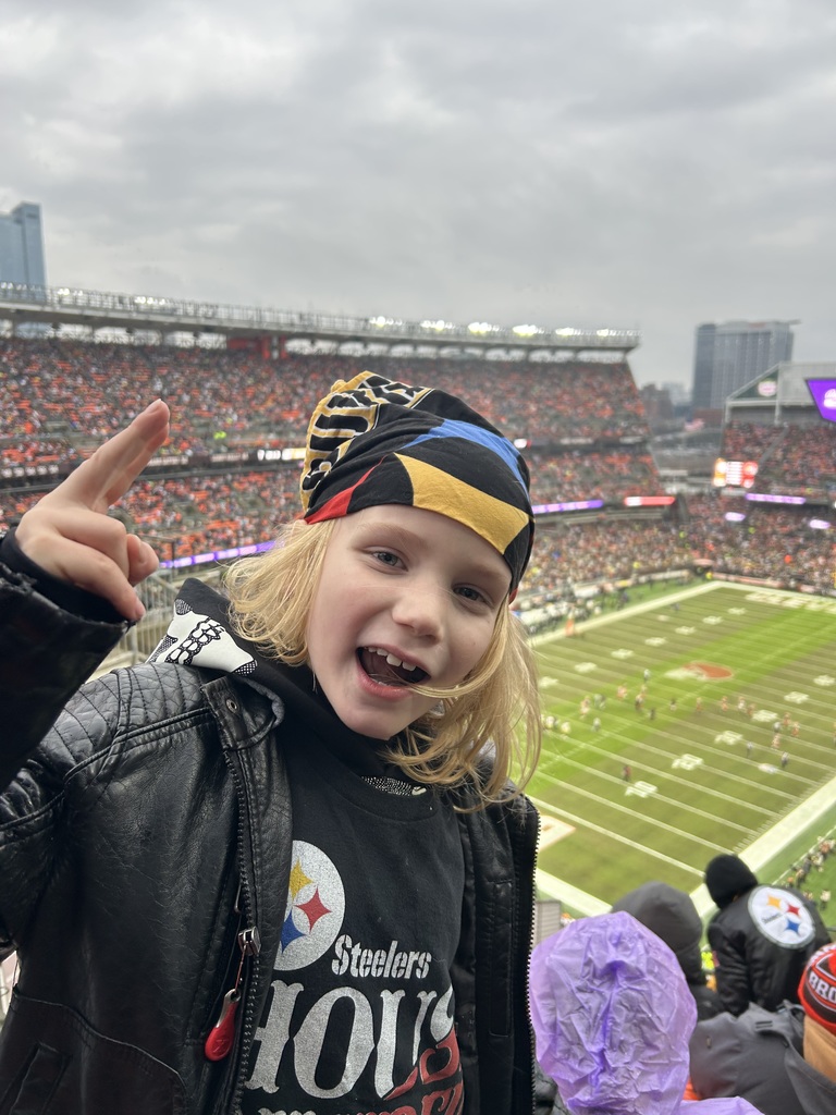 Mace weaing steelers gear with the the field in the background