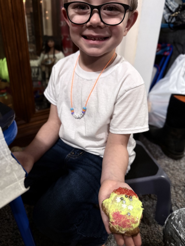 Raiden holding a cookie he decorated