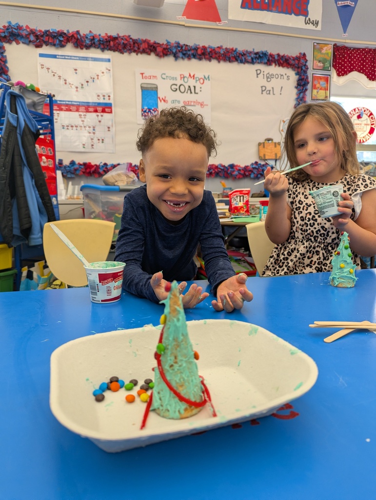 student smiling with his completed tree