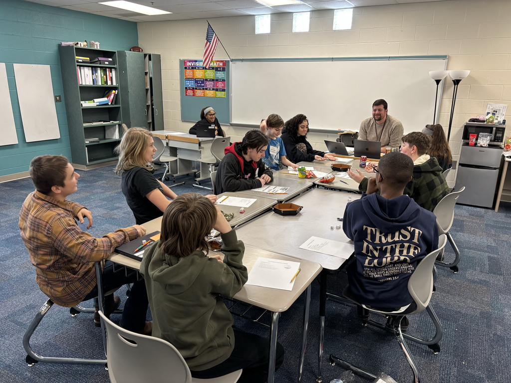 Students playing a board game
