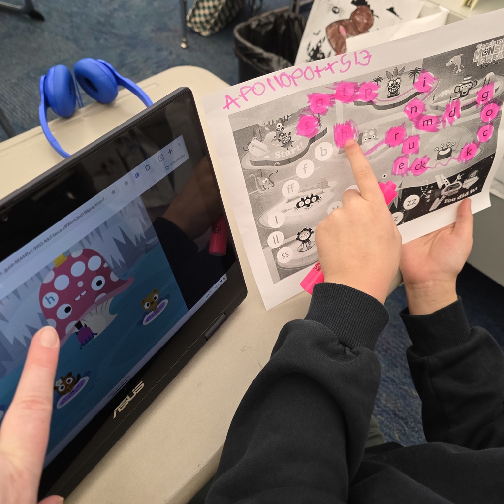 students showing their worksheets