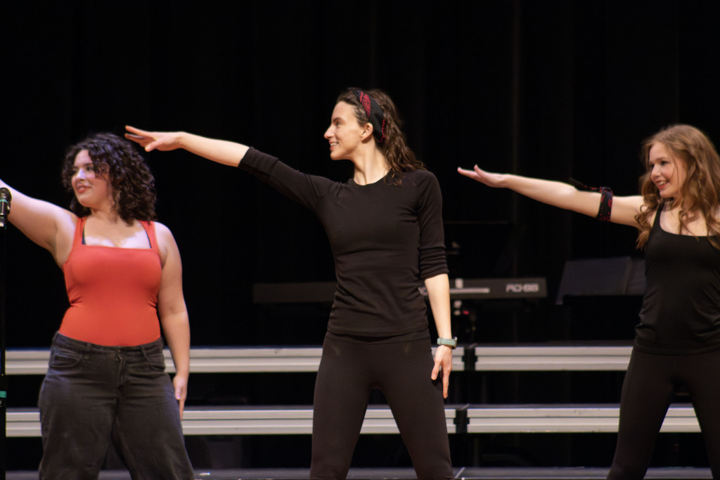 Teacher Kaylen McFarland dancing on stage