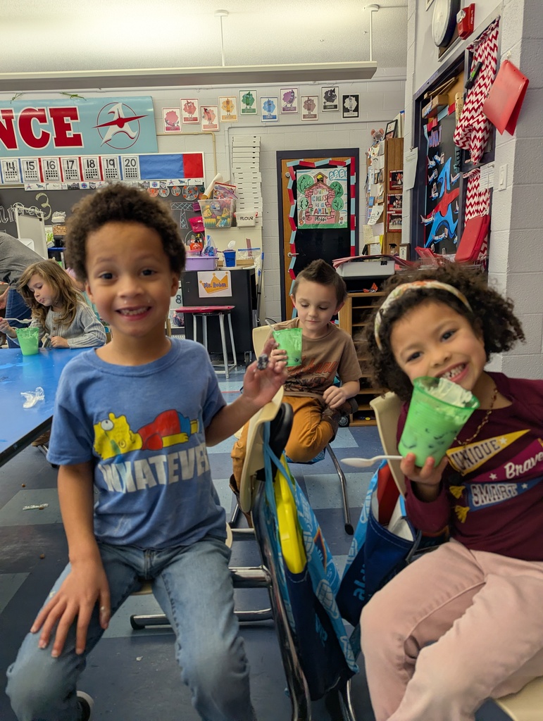 Two students smiling while eating parfaits