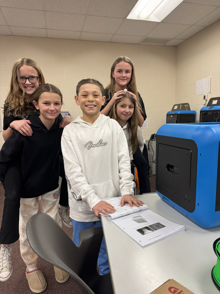 Ja'Cobi & his classmates by the printers