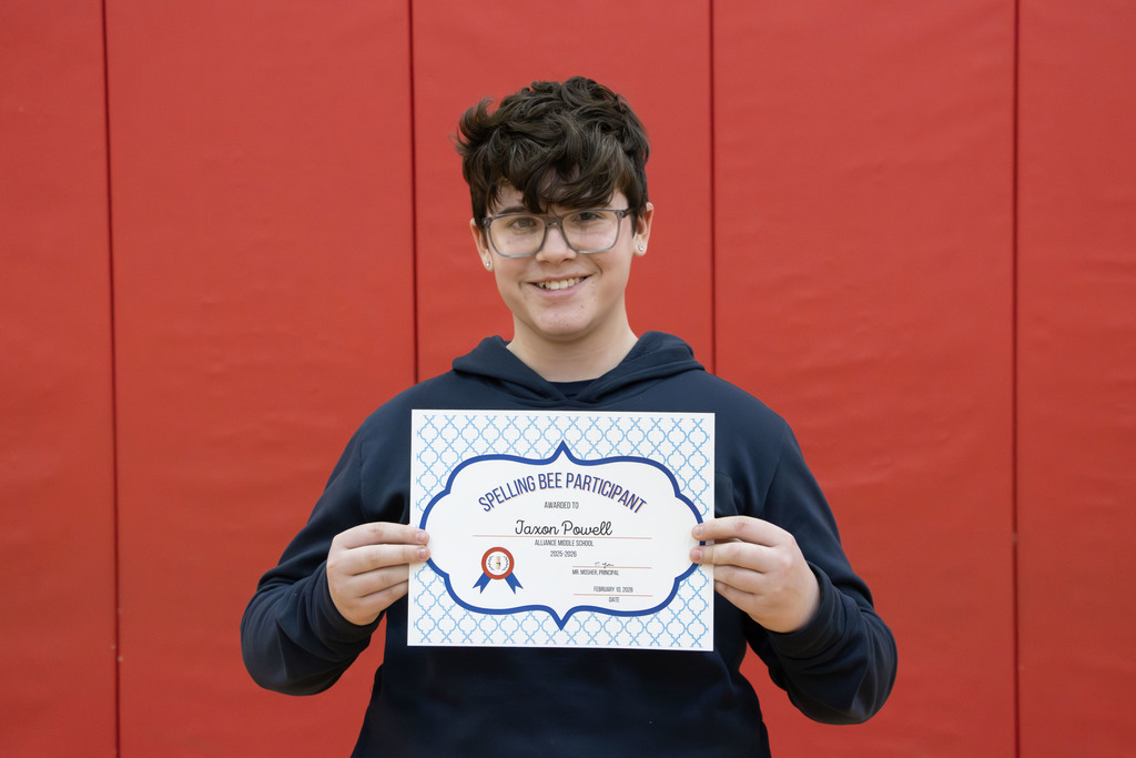 Pixture of Jaxon holding his certificate