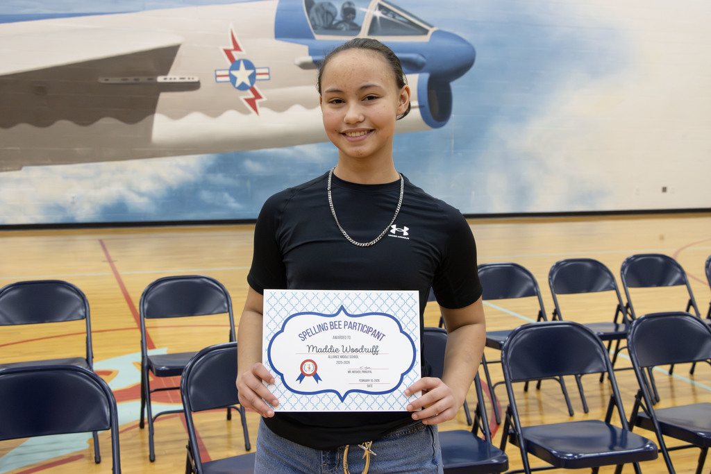 Picture of Maddie holding her certificate