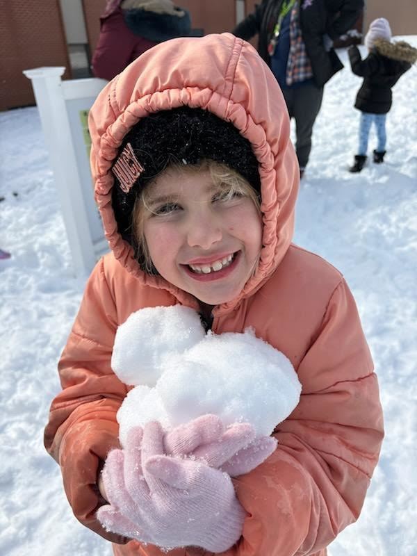 Students playing in the snow