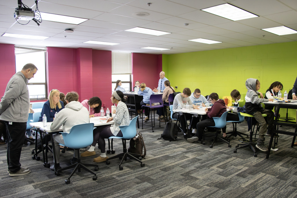Students talking at a table together