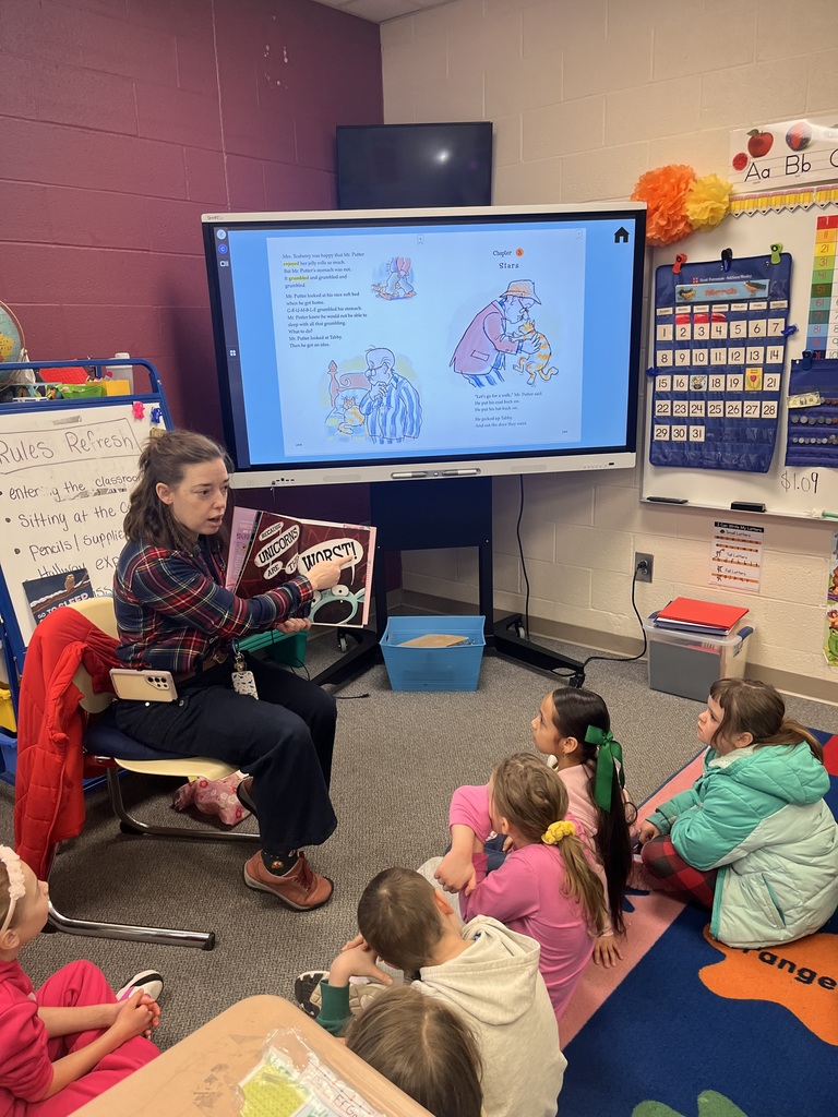 Ms. Driscoll reading to the class