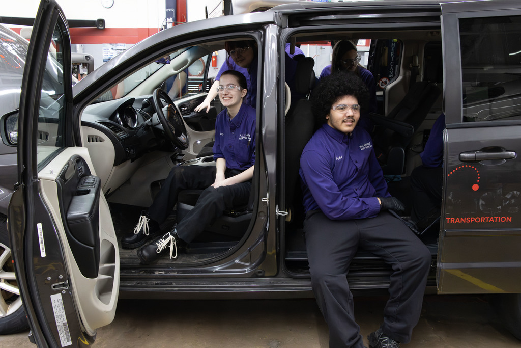 students sitting in the van