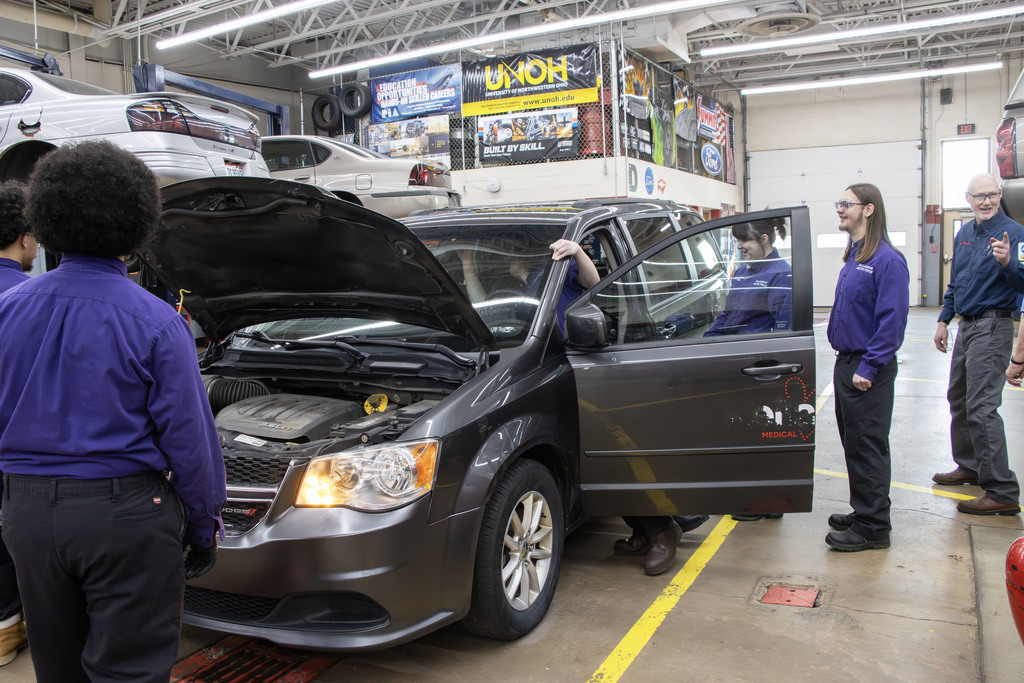 students looking through the van