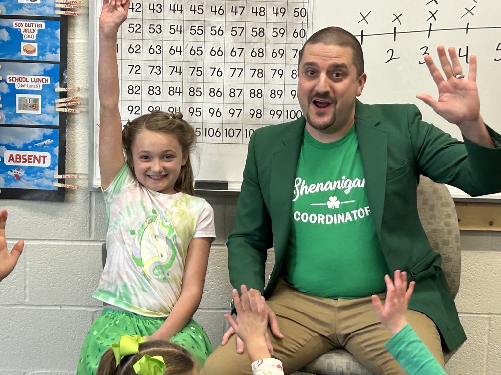 Addalyn and her dad both have their hands raised