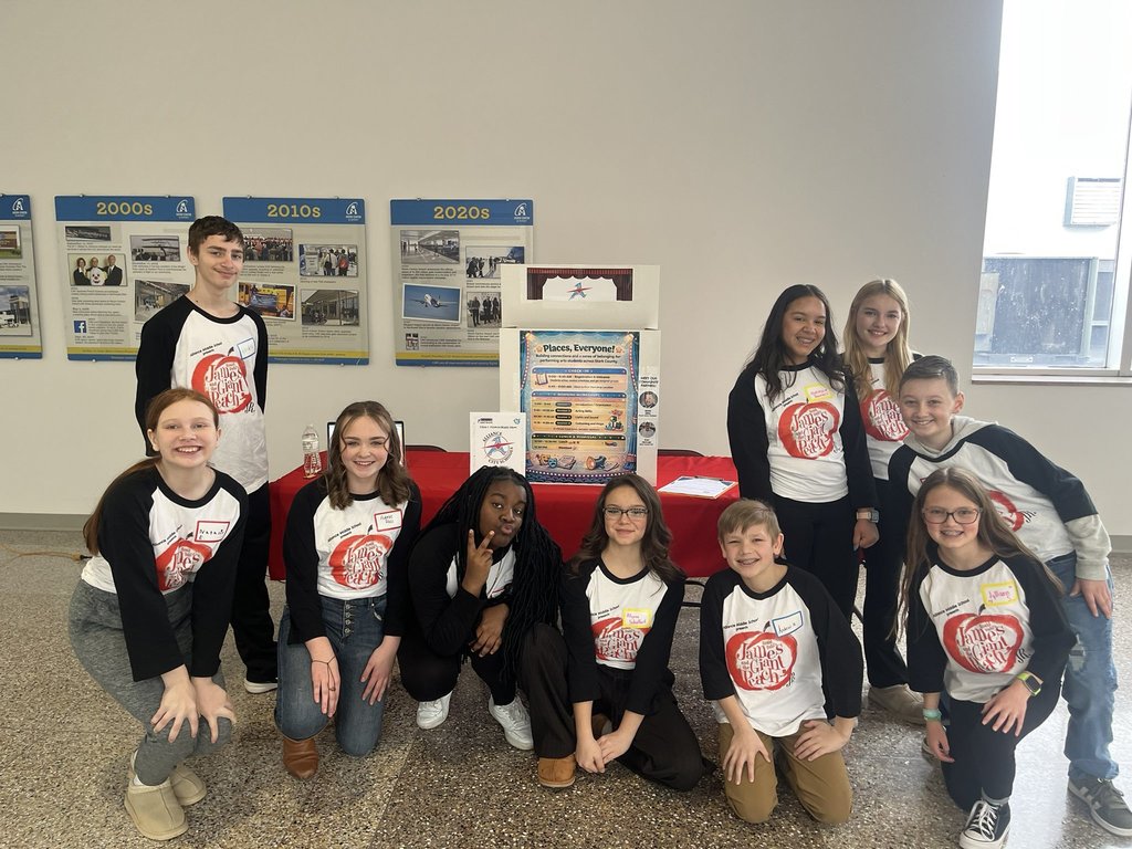 AMS students standing around their project as the akron canton airport