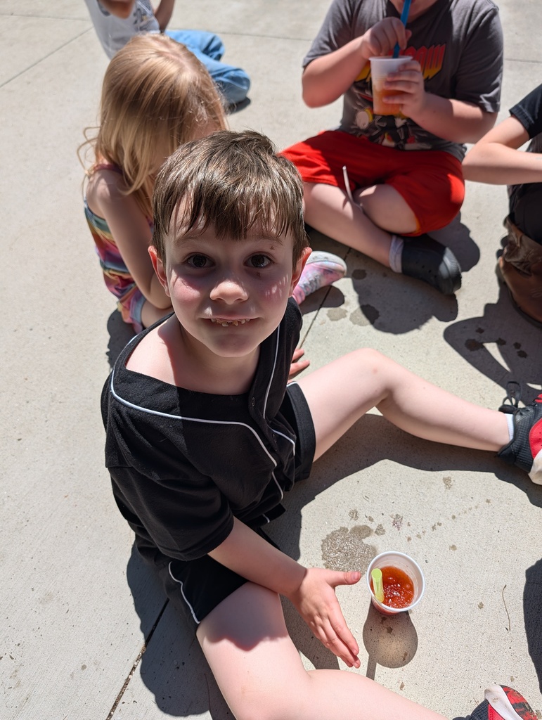 Students eating snow cones outside