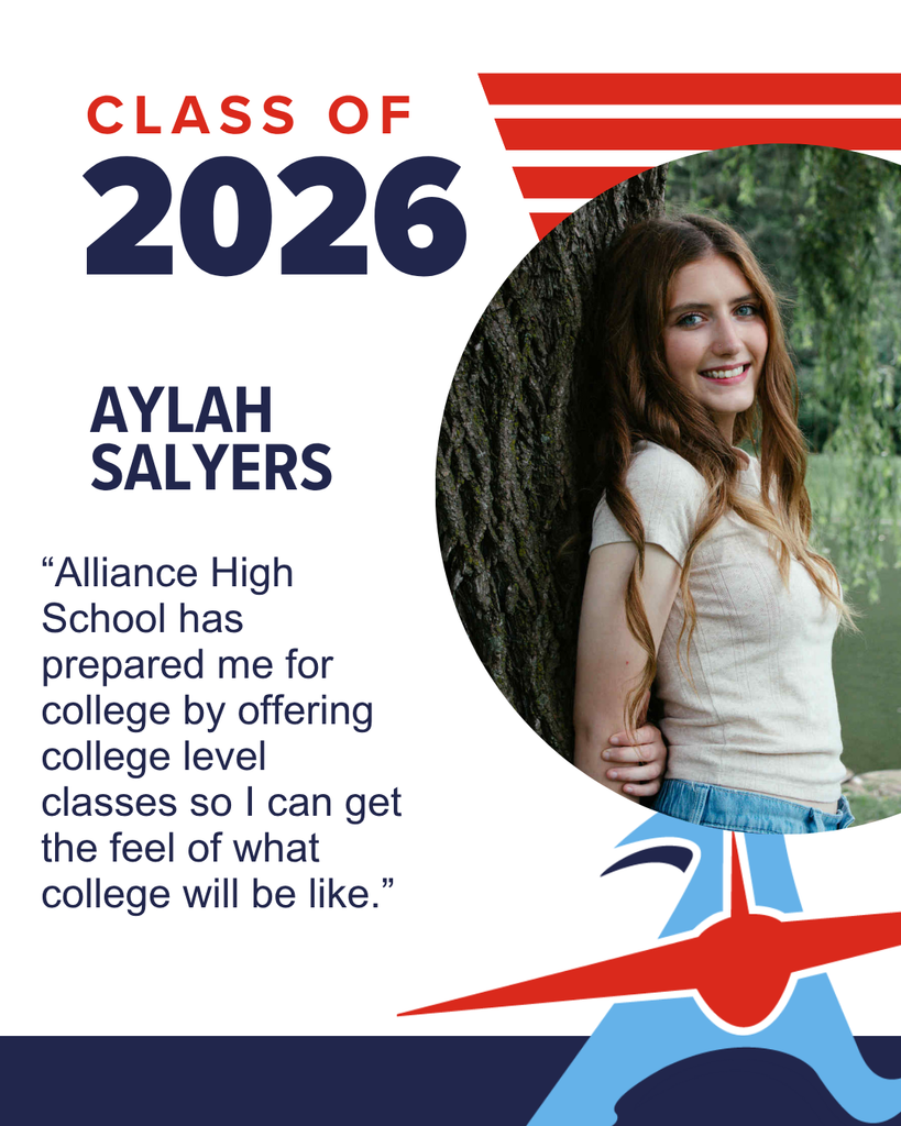 Aylah Salyers, Class of 2026, smiles while leaning against a tree.