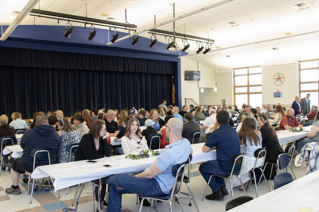 a picture of families sitting at tables