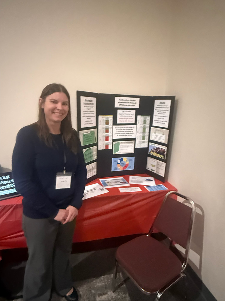 Liz Davis standing next to her presentation board