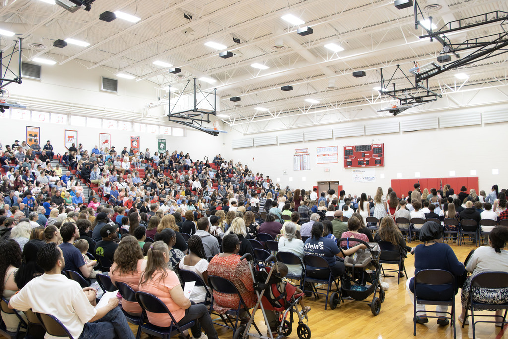 photo of all the students and families in the gym during the promotion ceremony