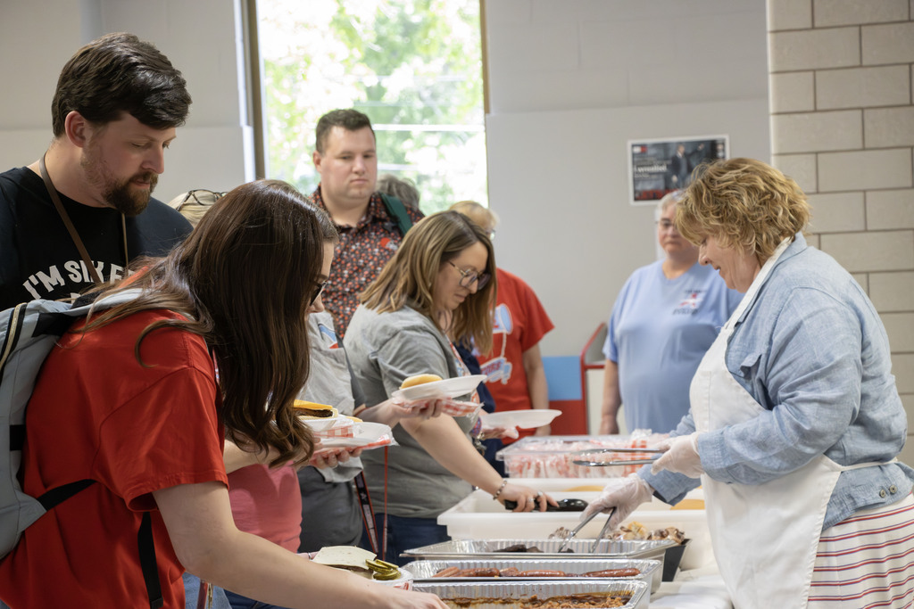 staff going through the food like at the cookout