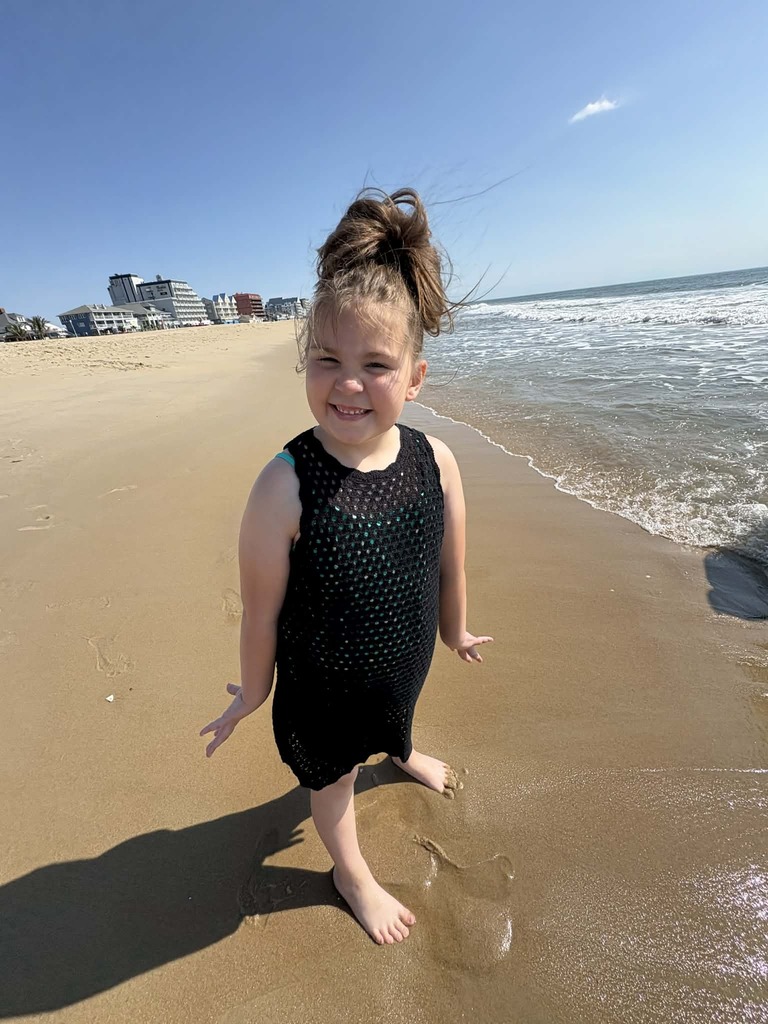 Ellison standing on the beach