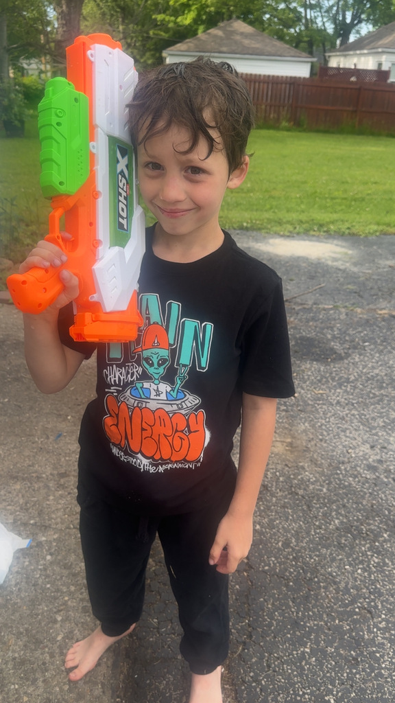 a student smiling while playing water games