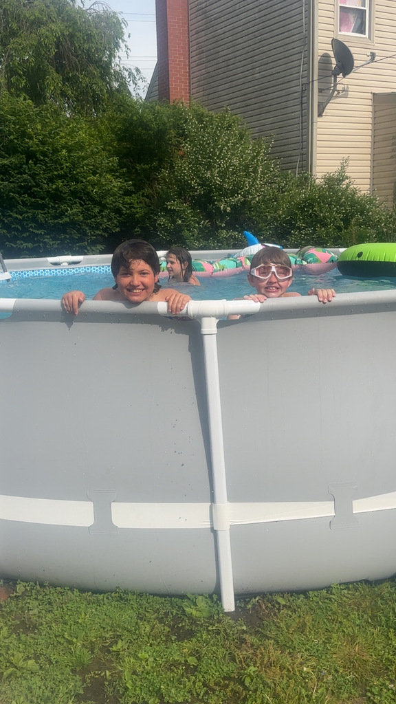 three student swimming in a pool