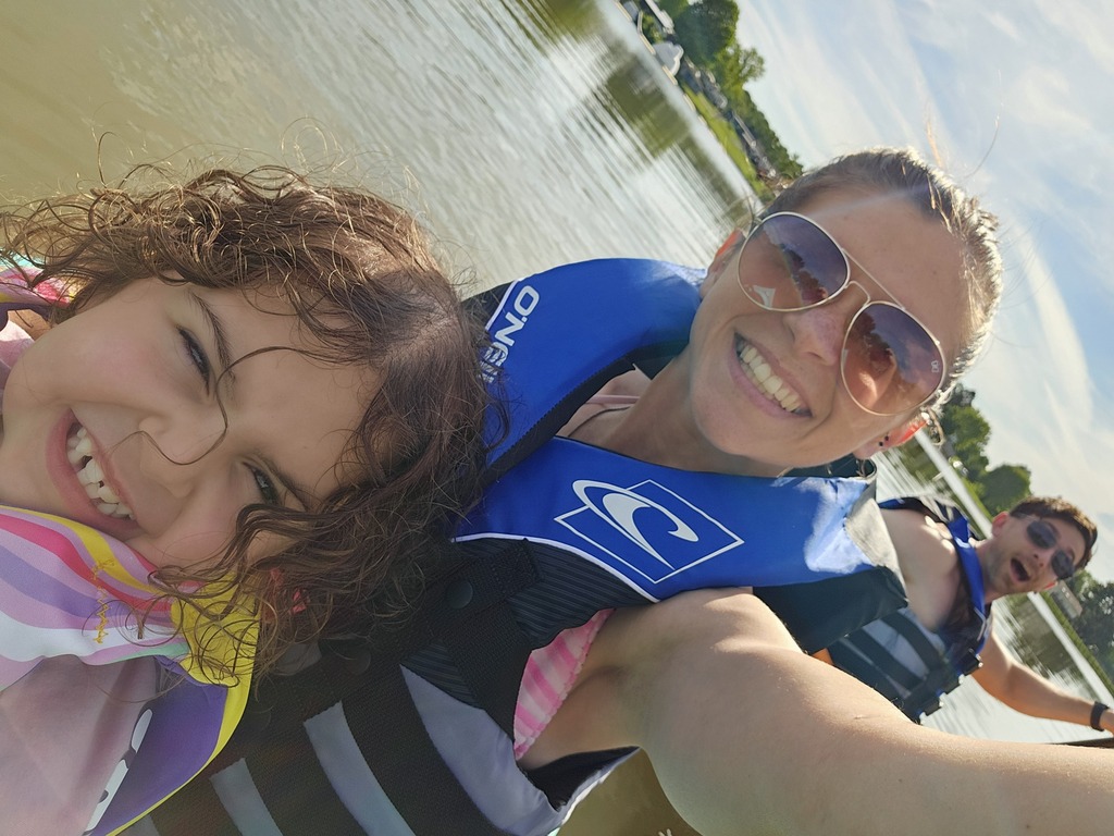 Kali in a kayak with her parents