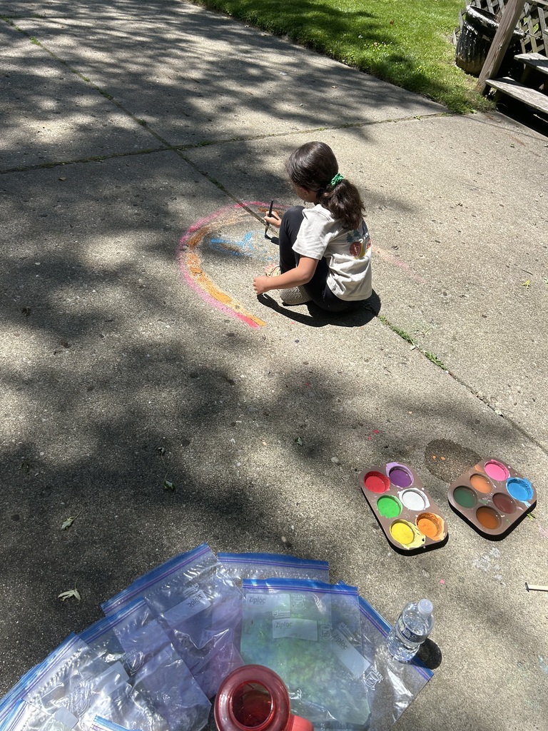 Raegan painting her driveway