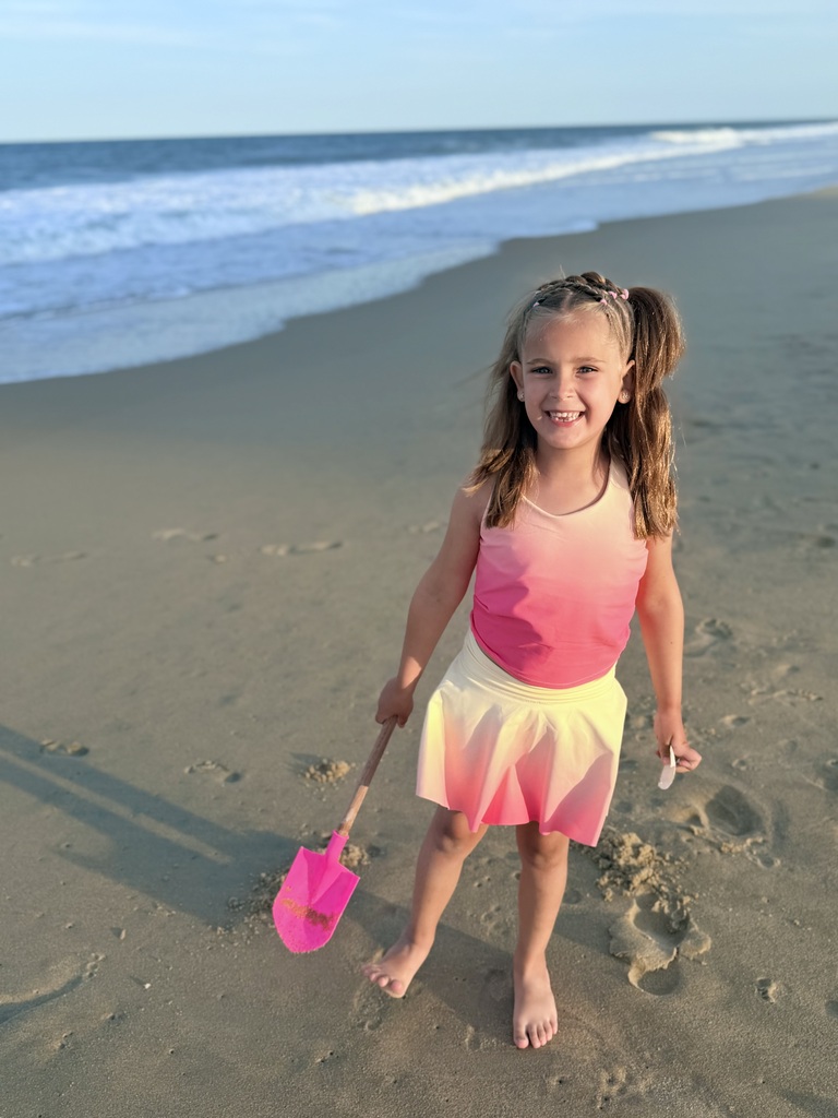 Kenzley digging in the sand on the beach