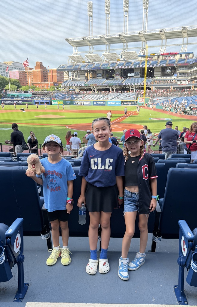 Bellamy, Oakley and Marlow standing in front of progressive field