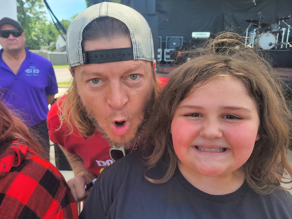 Khabri with a member of the band