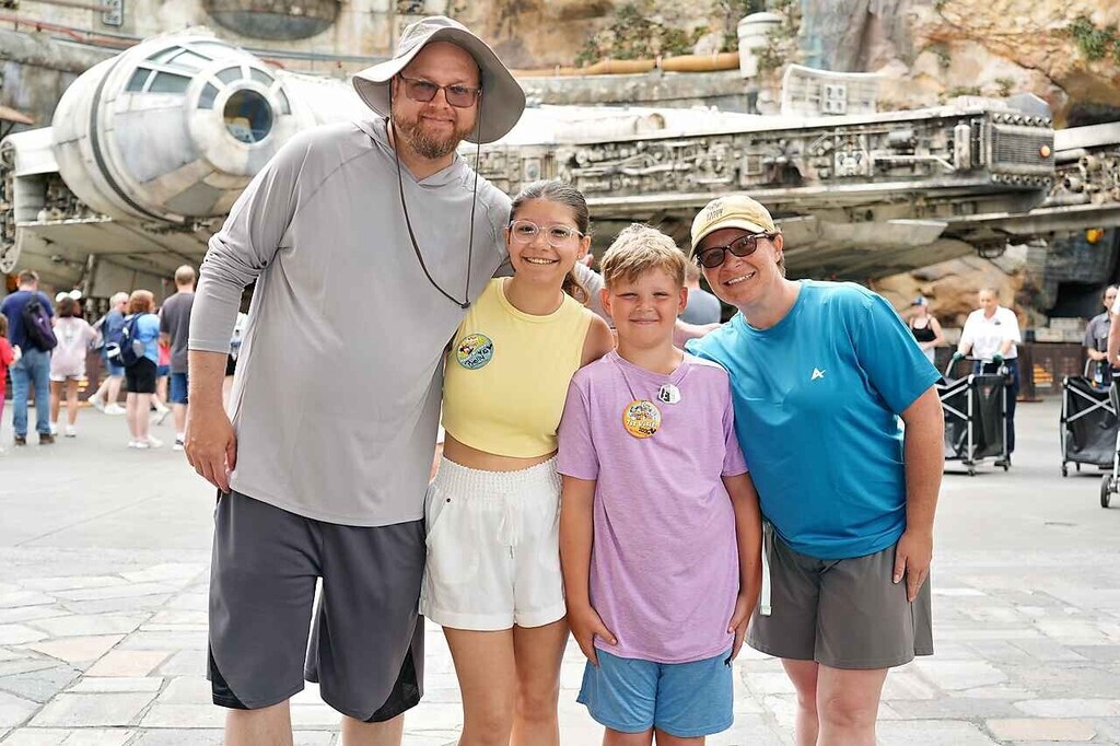Lemmon family standing in front of a star wars ship